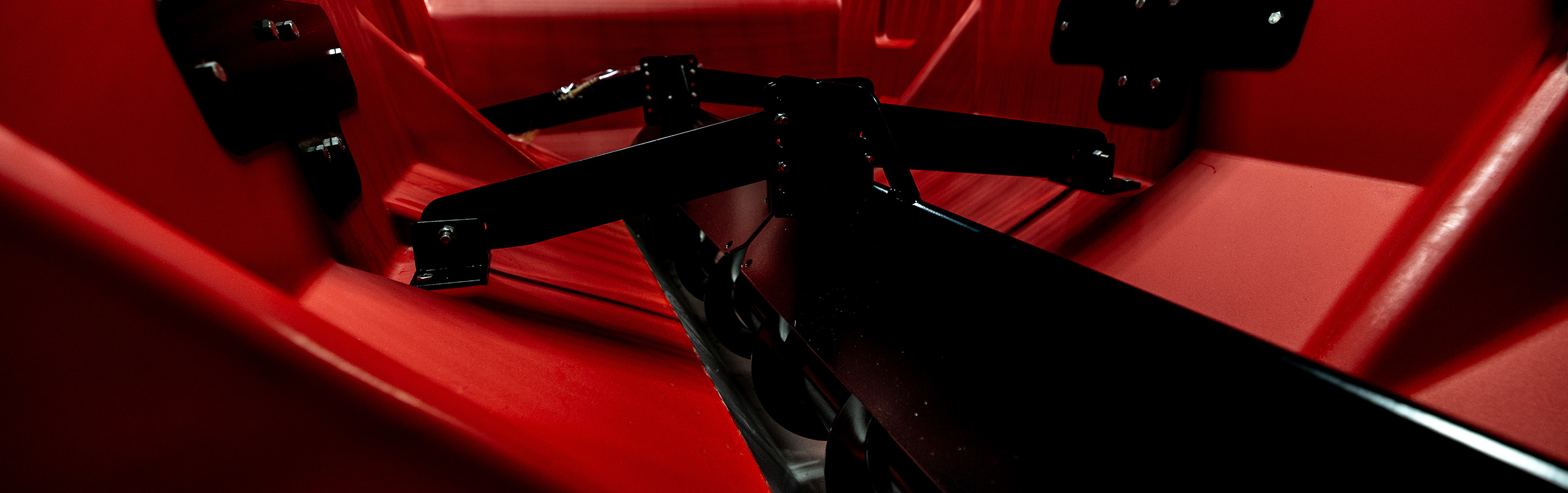 Photo of an auger on the inside of a VBX spreader