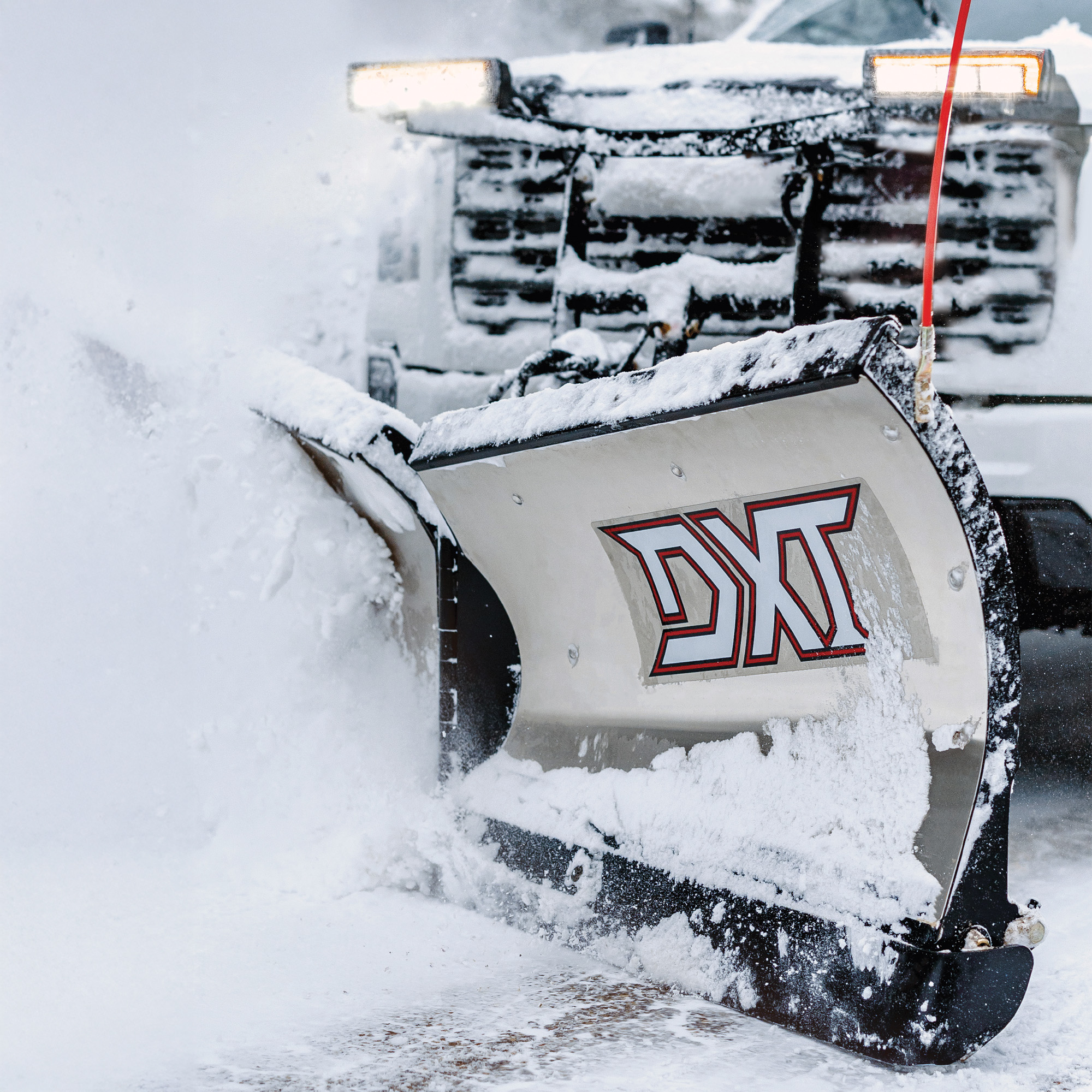 Full Line Brochure Image - Stainless Steel DXT plowing snow 